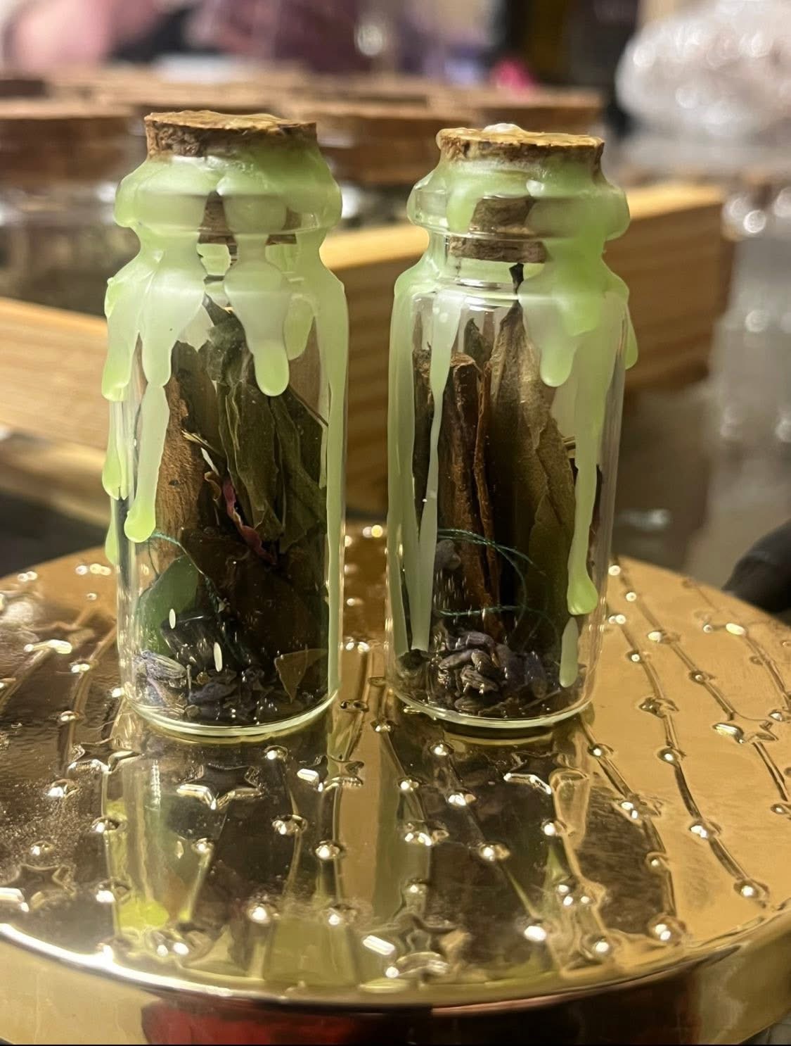 Pair of protection spell jars sealed with green candle wax