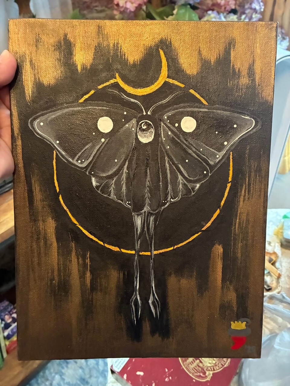 Luna moth painting with a golden halo
