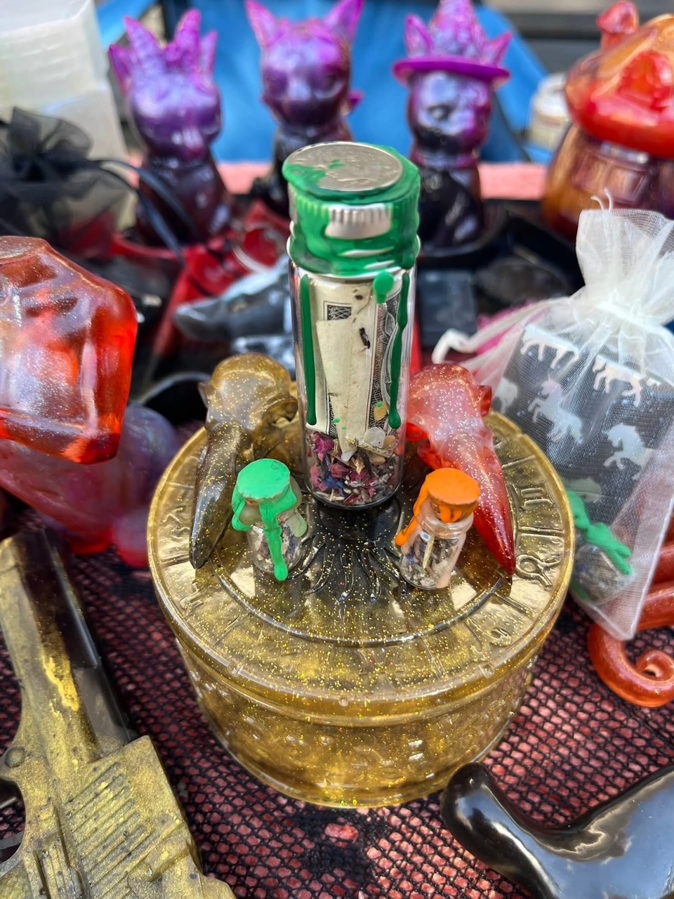 Manifestation altar jar surrounded by resin ritual objects