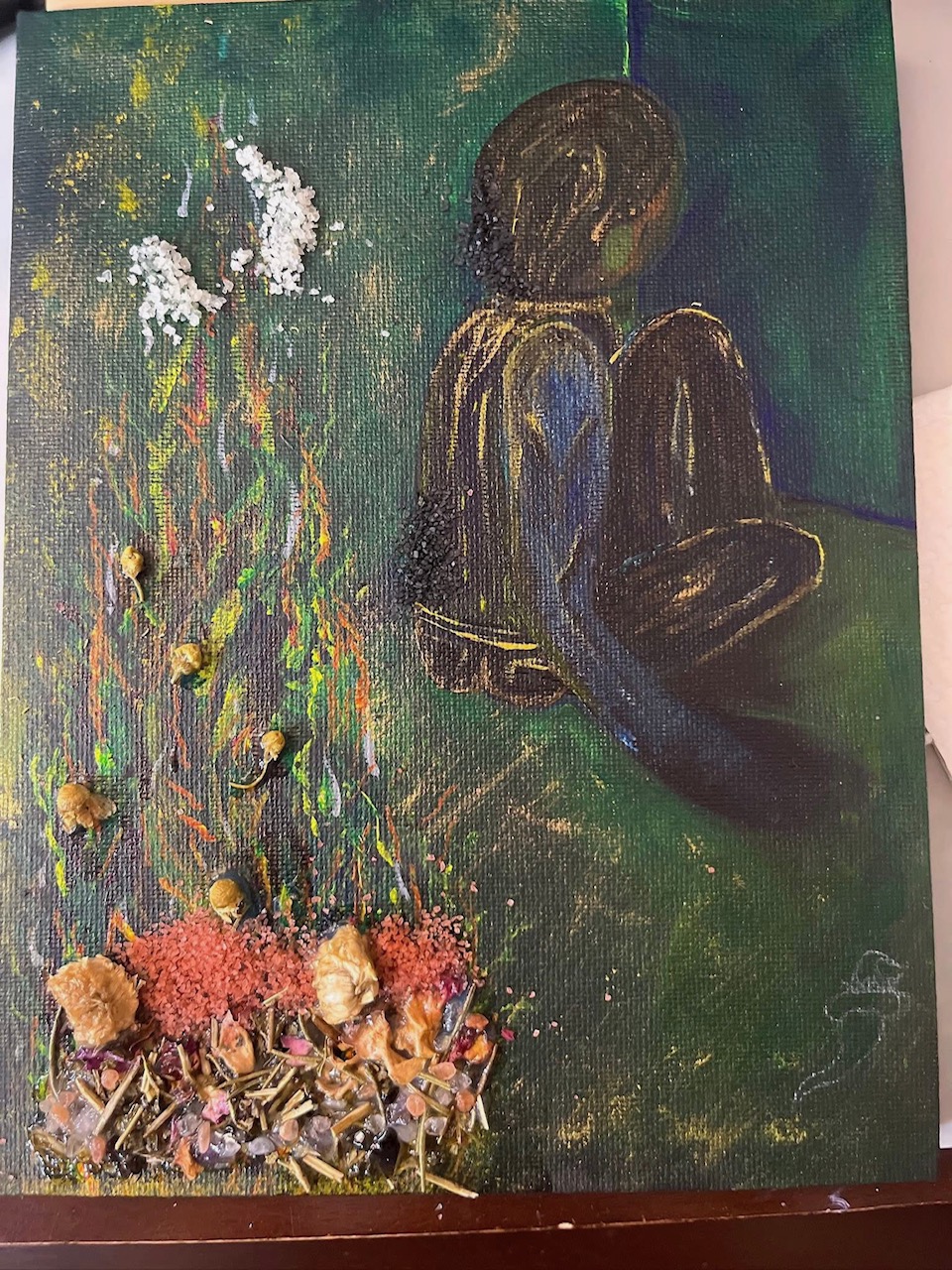 Meditative figure beside botanical mixed-media textures