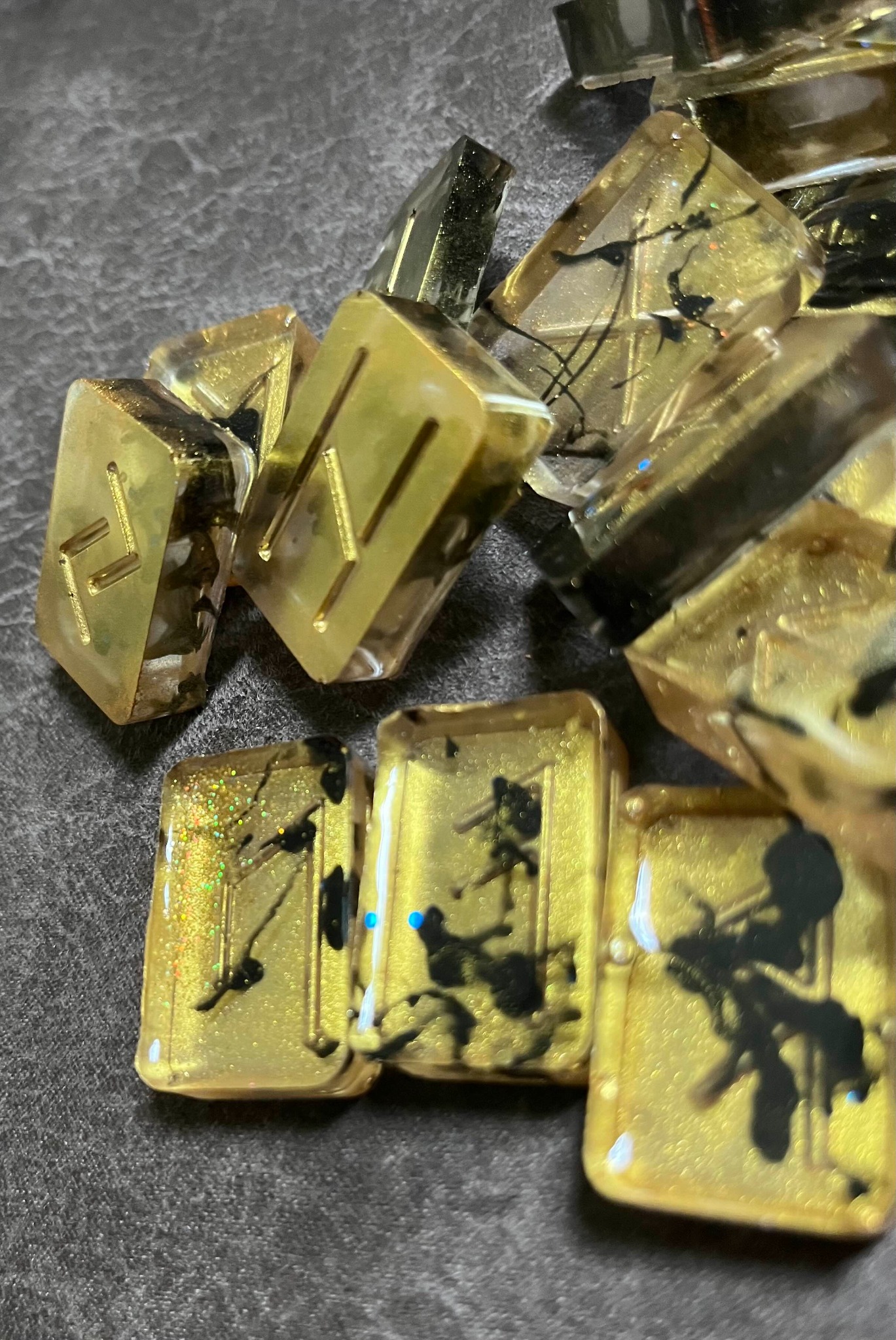 Gold resin rune set with black marbling